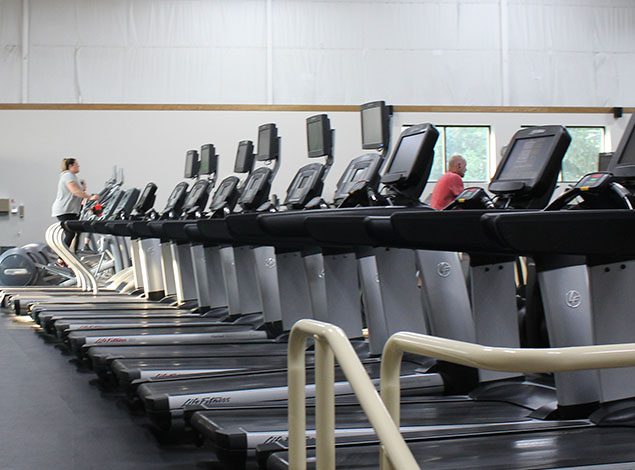 rows of cardio machines for cardio training