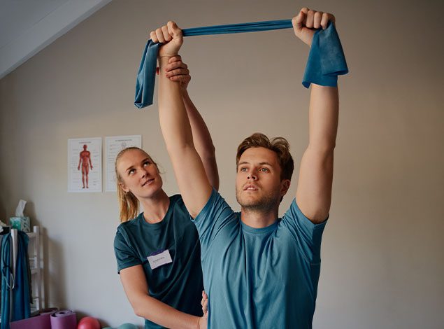 physical therapist working with a man