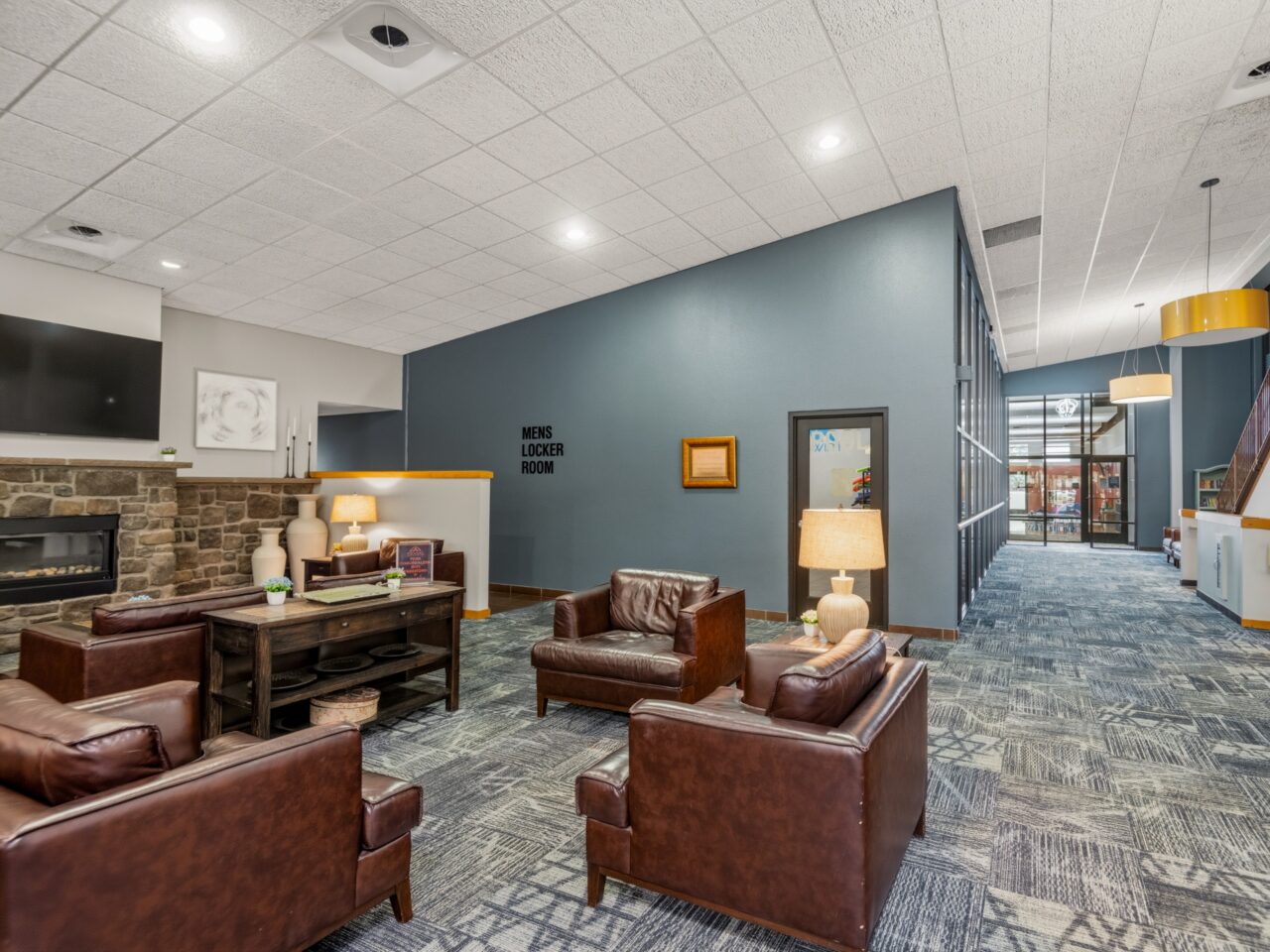 Comfortable member lounge and lobby seating area inside Peak Health & Wellness Coeur d'Alene.