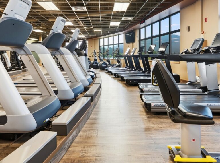 Cardio floor with treadmills, elliptical machines, and stationary bikes at Peak Health & Wellness Hayden.
