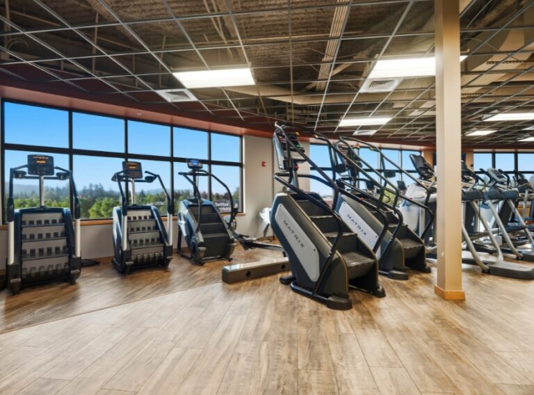 Stair climbers, ellipticals, and additional cardio equipment at Peak Health & Wellness Hayden.