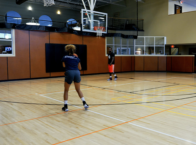people playing basketball indoors