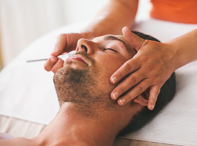 man getting a massage on head