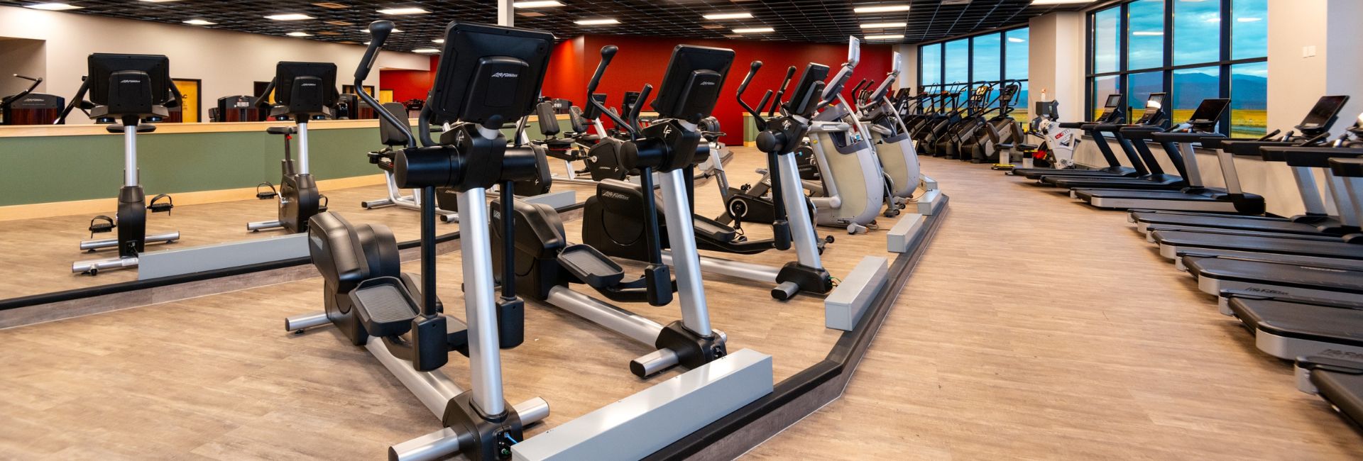 a row of treadmills and elliptical machines at a gym near me in post falls idaho